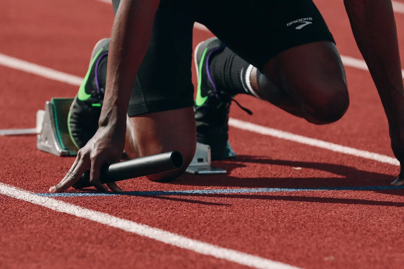 Sprinter on a track, ready at the blocks